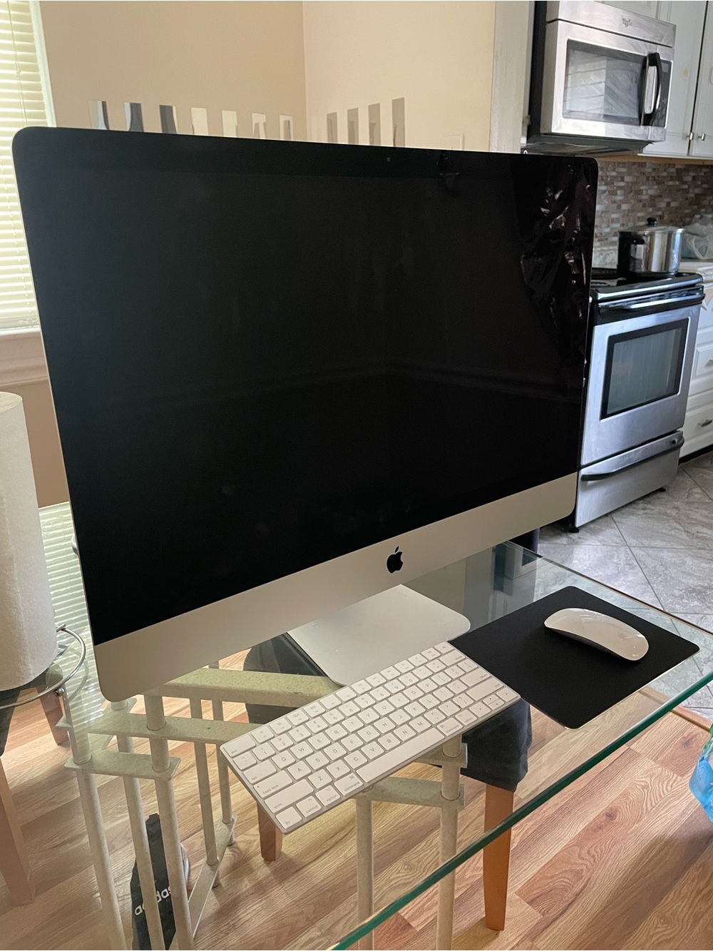 Apple iMac in Silver with Black Screen and White Accessories